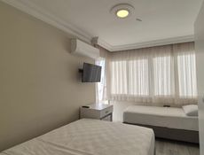 Üç Kişilik Aile Şehir Manzaralı - Balkonlu Oda