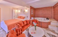 Orange Room with Fireplace and Jacuzzi