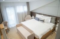 Pokój typu deluxe z tarasem, łóżkiem typu king-size