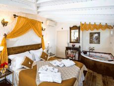 Deluxe Flitterwochenzimmer mit Whirlpool und privater Gartenterrasse